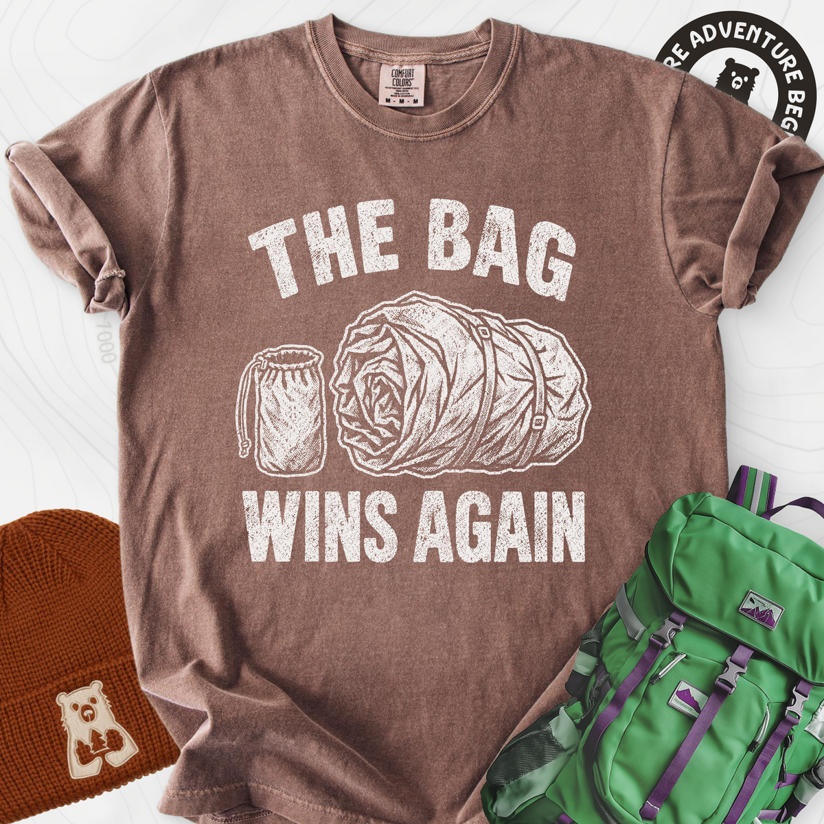 The Bag Wins Again T-Shirt — Espresso — Front print [studio:1j9HOk8H6XVU87bTz1Mtt05NKr3VR5bhK]