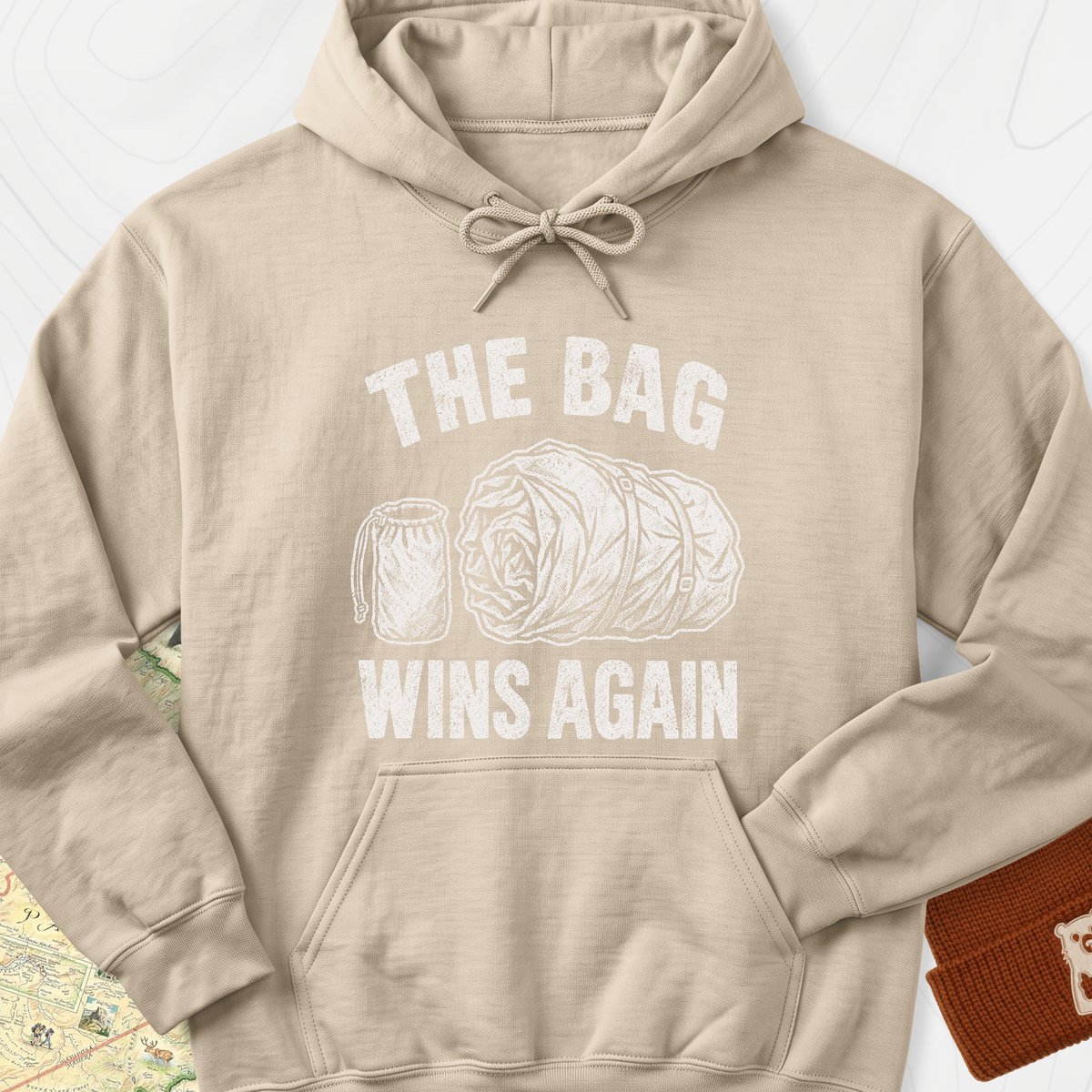 The Bag Wins Again Hoodie — Sand — Front print [studio:1IJZoxC149n4jlZby9CIXafXXZh1rGA0E]